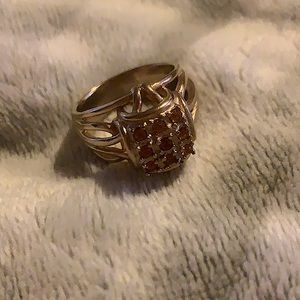 Unisex- Gold tone ring with colored orange gem stones